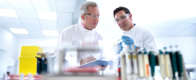 Scientists Discussing Test Results in Laboratory